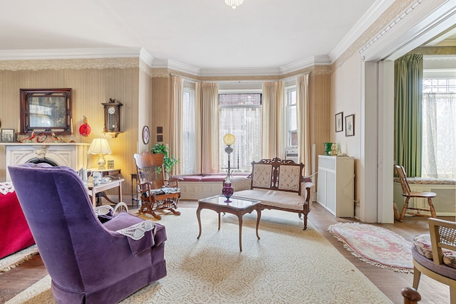 living area featuring ornamental molding and wood-type flooring