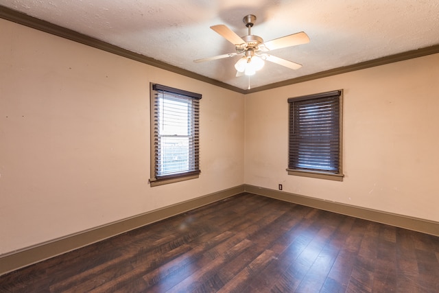 spare room featuring dark wood-type flooring, a textured ceiling, ceiling fan, and crown molding