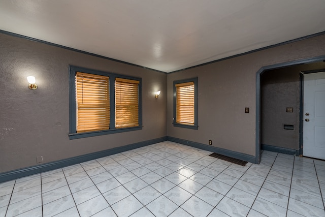 empty room featuring light tile patterned floors