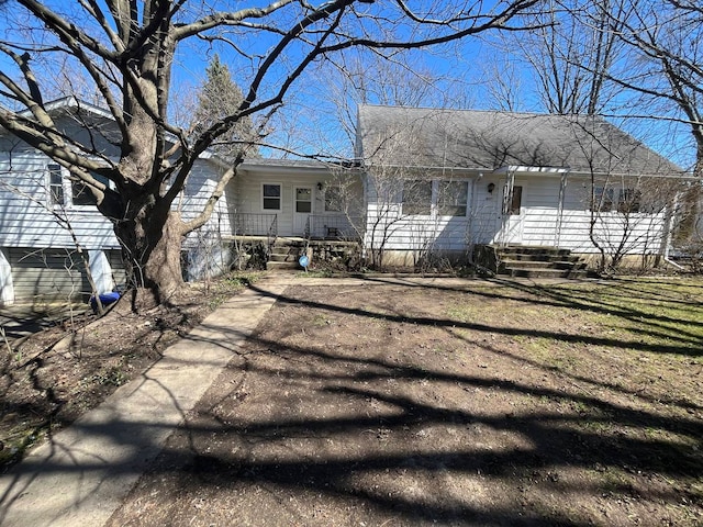 rear view of house with a porch