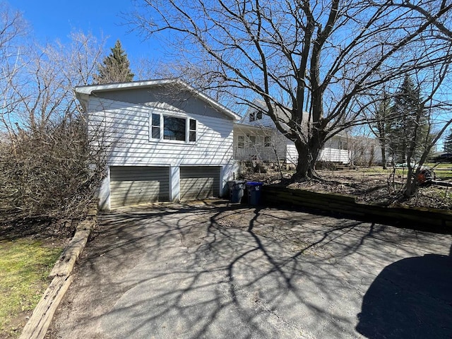 view of side of property featuring a garage