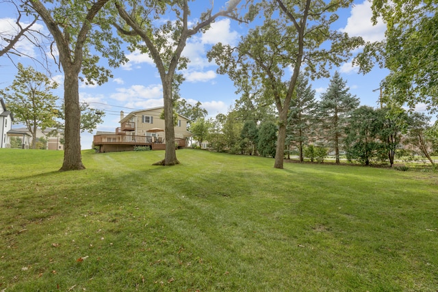 view of yard with a wooden deck