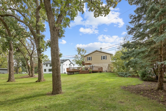 view of yard featuring a wooden deck