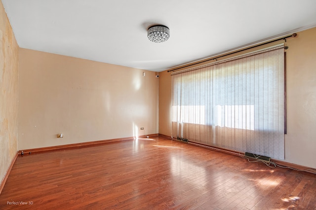 empty room featuring hardwood / wood-style floors