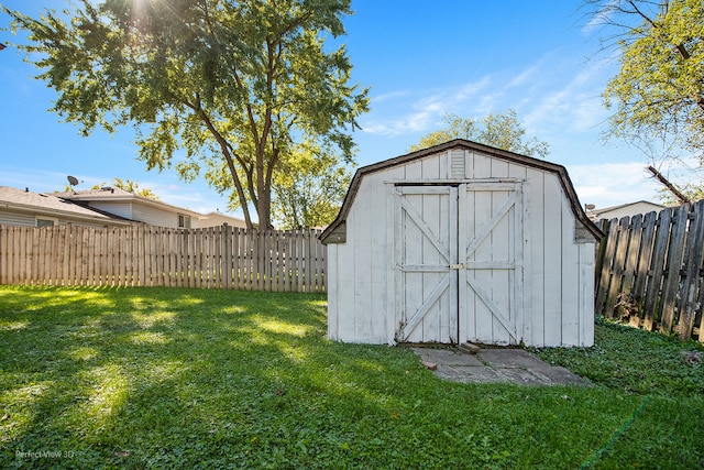 view of outdoor structure featuring a lawn