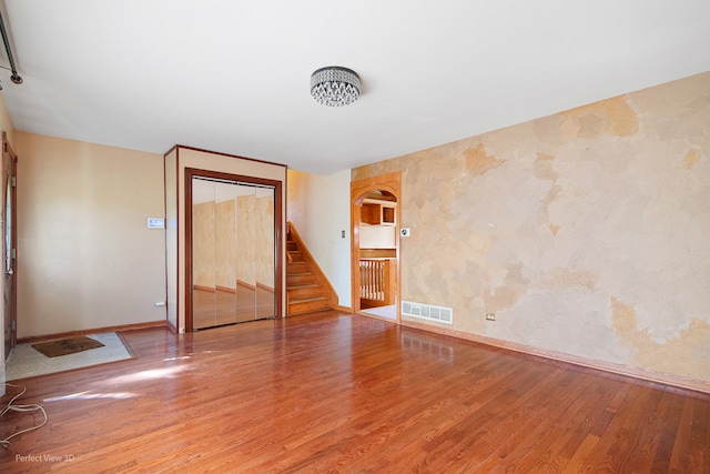 spare room featuring hardwood / wood-style flooring