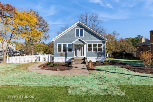 bungalow with a front yard