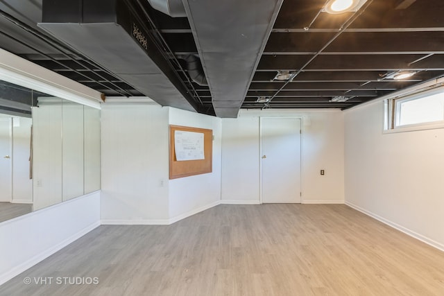 basement featuring light hardwood / wood-style floors