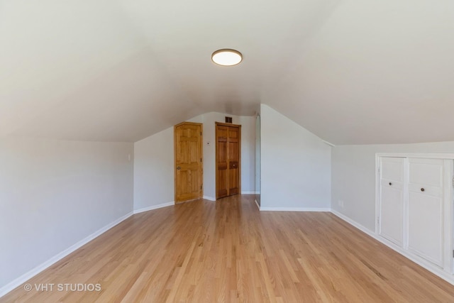14557 W Ave, Orland Park, IL 60462 - additional living space featuring light wood finished floors, baseboards, and lofted ceiling
