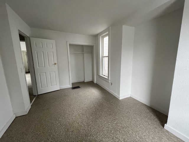 unfurnished bedroom featuring a closet