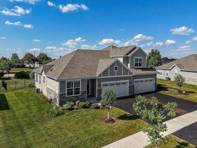 25556 W Springview Dr, Plainfield, IL 60586 - craftsman house with stone siding, driveway, a shingled roof, and a garage