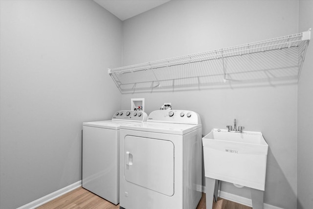 25556 W Springview Dr, Plainfield, IL 60586 - laundry room with washing machine and dryer and light wood-style floors