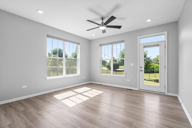 25556 W Springview Dr, Plainfield, IL 60586 - unfurnished room with wood finished floors, ceiling fan, and recessed lighting