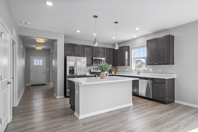 25556 W Springview Dr, Plainfield, IL 60586 - kitchen featuring stainless steel appliances, light wood-style floors, light countertops, recessed lighting, and a kitchen island