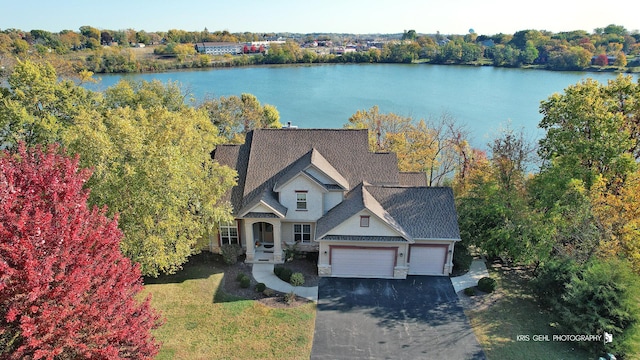 birds eye view of property featuring a water view