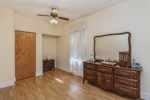 bedroom with light hardwood / wood-style floors and ceiling fan