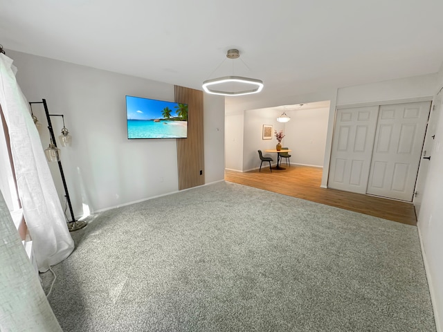 unfurnished living room featuring hardwood / wood-style flooring