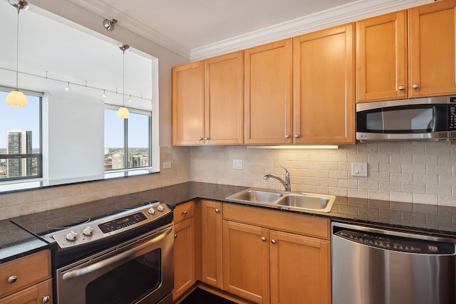 kitchen with sink, decorative backsplash, appliances with stainless steel finishes, decorative light fixtures, and crown molding