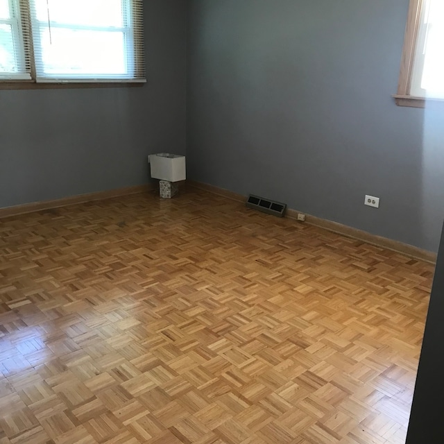 spare room featuring light parquet flooring