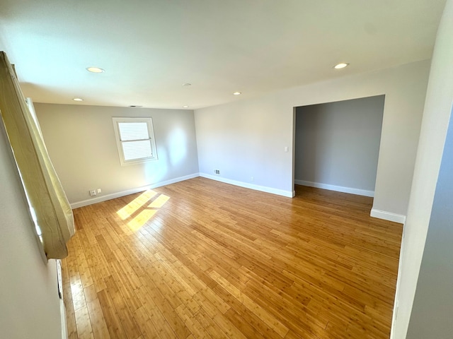 unfurnished room with light hardwood / wood-style floors