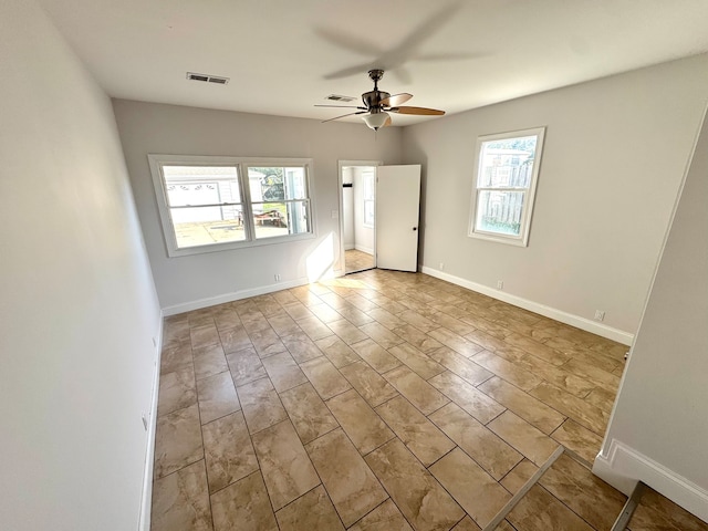 spare room featuring light hardwood / wood-style floors and ceiling fan