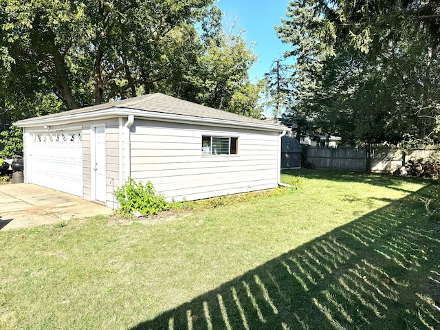 garage with a lawn