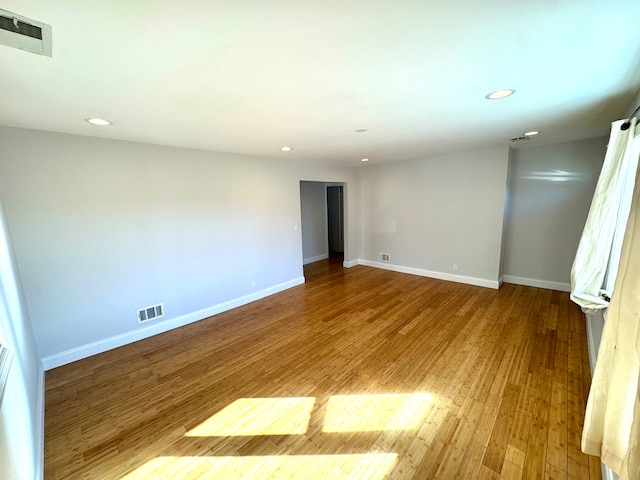 empty room with wood-type flooring