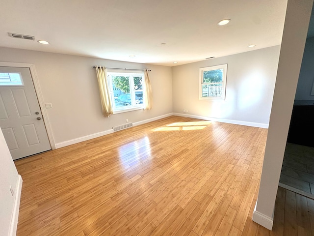 unfurnished room featuring light hardwood / wood-style floors