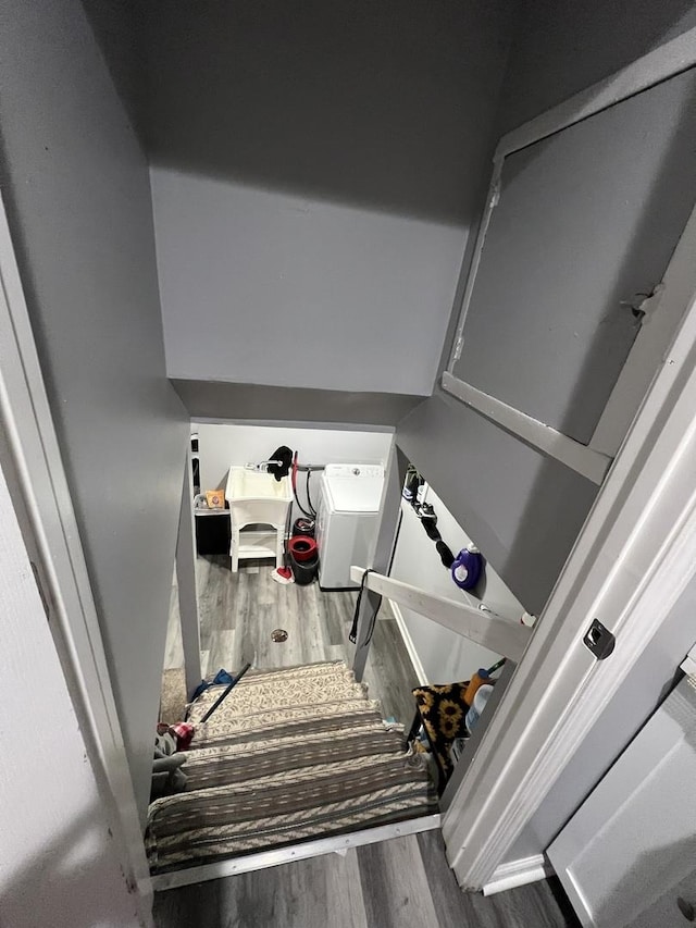 stairs featuring wood-type flooring