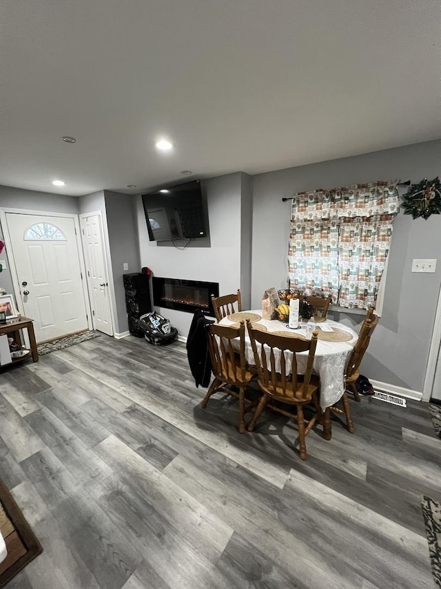 dining area featuring hardwood / wood-style floors