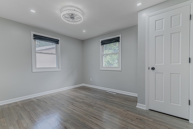 spare room featuring hardwood / wood-style flooring