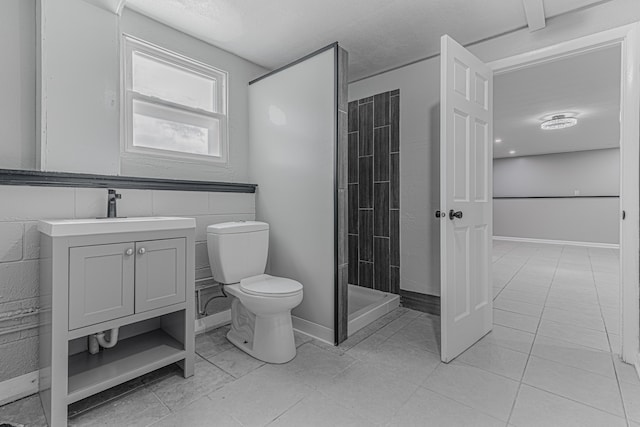 bathroom with walk in shower, tile patterned flooring, vanity, and toilet