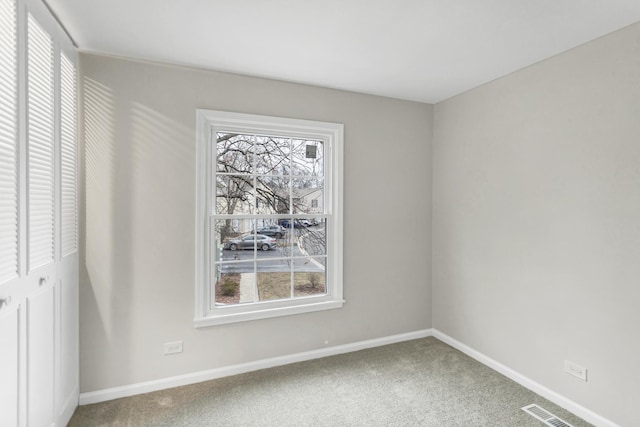 unfurnished room with carpet floors