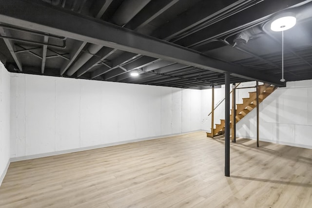 basement featuring hardwood / wood-style floors