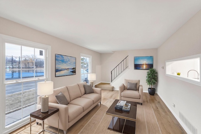 living room with light hardwood / wood-style flooring