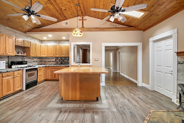 kitchen featuring a skylight, wood ceiling, white appliances, butcher block countertops, and decorative light fixtures