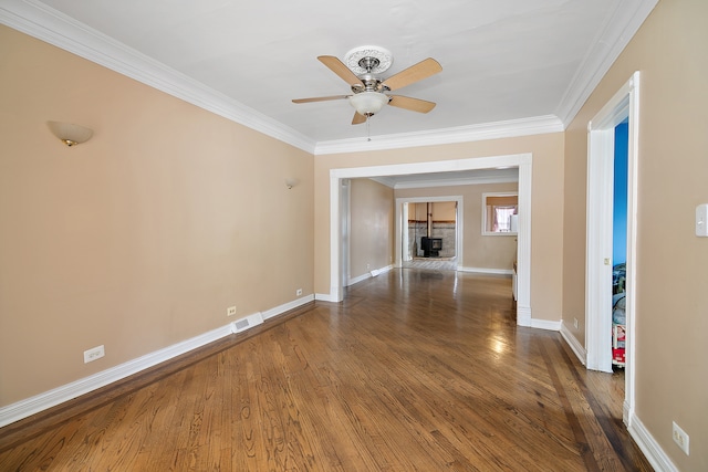 interior space with ornamental molding, dark hardwood / wood-style flooring, and ceiling fan