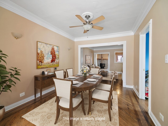 dining space featuring crown molding, dark hardwood / wood-style flooring, and ceiling fan