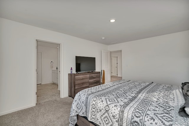 bedroom with light colored carpet