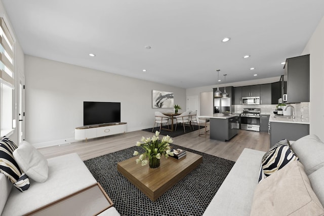 1003 Florence St, Lemont, IL 60439 - living area featuring light wood-style flooring, recessed lighting, and baseboards