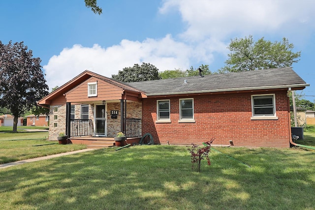 ranch-style home with a front lawn and brick siding