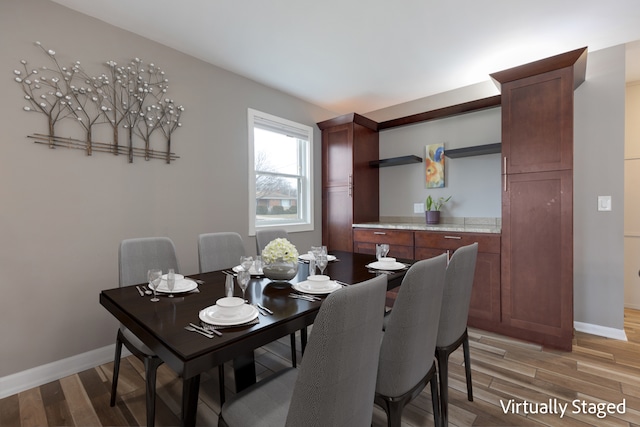 dining room featuring hardwood / wood-style flooring