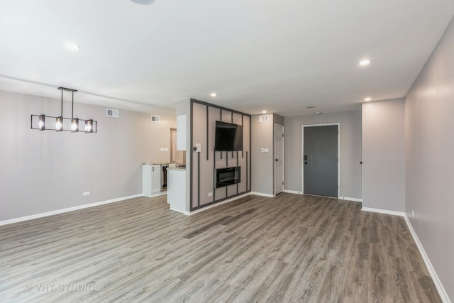 unfurnished living room with light wood-type flooring