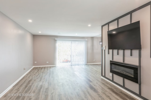 unfurnished living room with light hardwood / wood-style floors