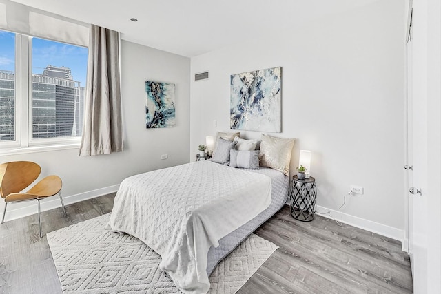 bedroom with wood-type flooring