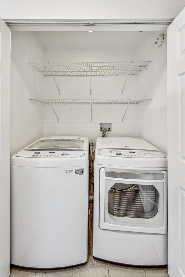 washroom with washer and clothes dryer