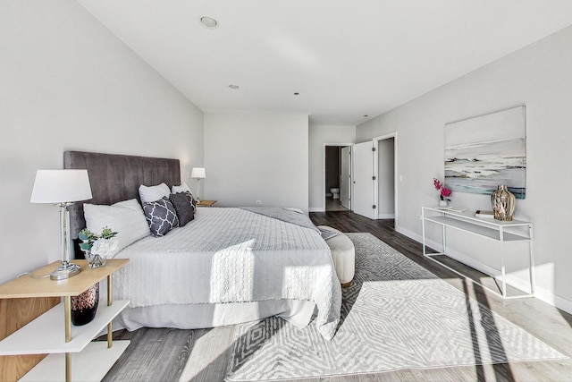 bedroom with hardwood / wood-style floors