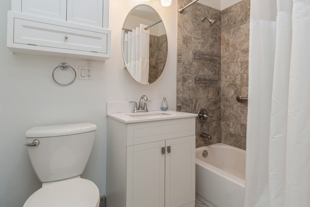 full bathroom featuring shower / bath combo, vanity, and toilet