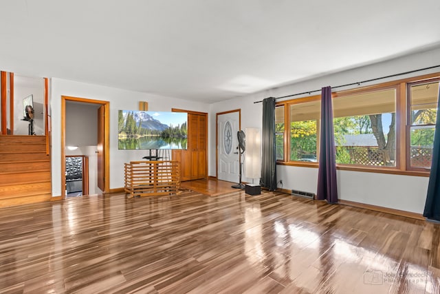 unfurnished living room featuring hardwood / wood-style floors