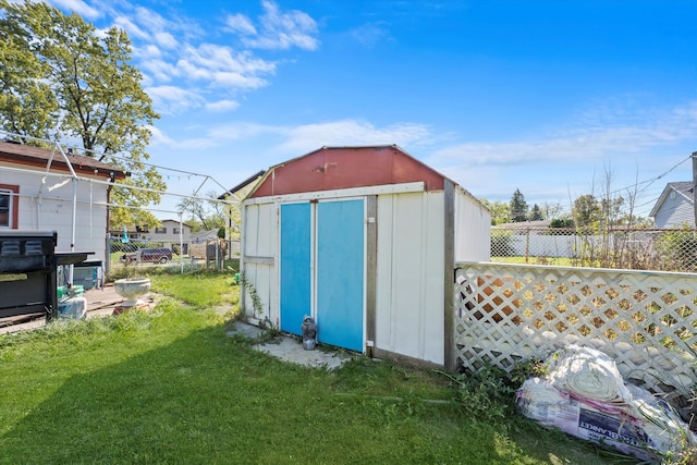 view of outbuilding featuring a lawn